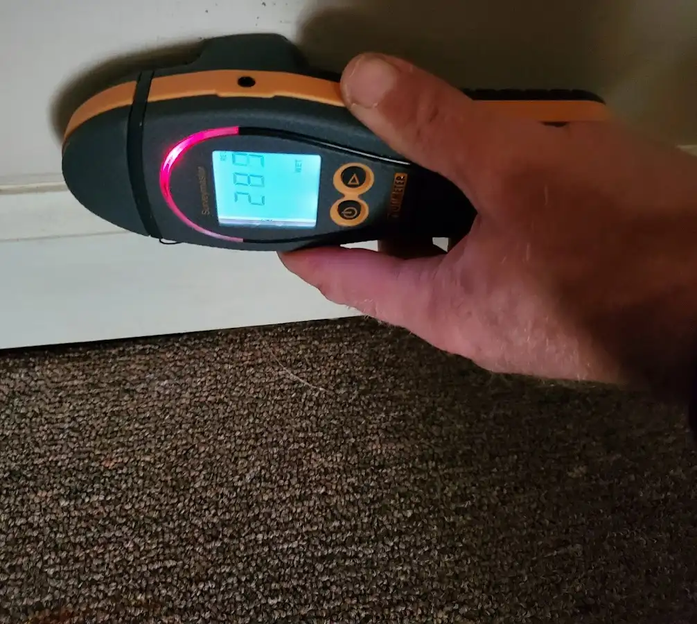 Moisture detection at baseboard during Storm Damage Restoration in Carlisle